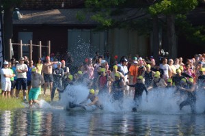 Mens swim start Jared (bare chest) dives in ..