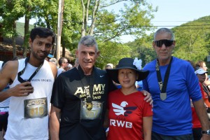 Relay team at finihs with medals and West Point's Superintendent Gen. Caslen.