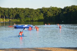 lifeguards head out onto swim course